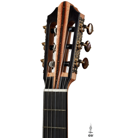 The headstock of a 2025 Kris Barnett classical guitar made of cedar and exotic ebony