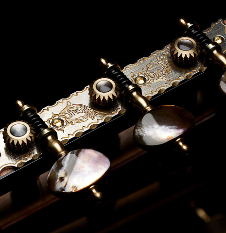 The tuning machines of a 2025 Kris Barnett classical guitar made of cedar and exotic ebony