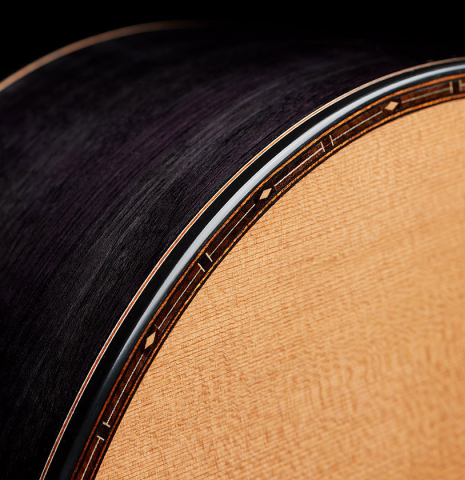 The top binding and purflings of a 2025 Kris Barnett classical guitar made of cedar and exotic ebony