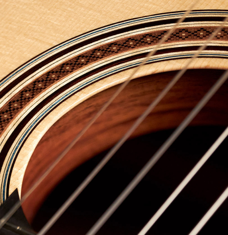 The rosette, soundhole and tornavoz of a 2023 Marco Bortolozzo classical guitar made with spruce and ziricote