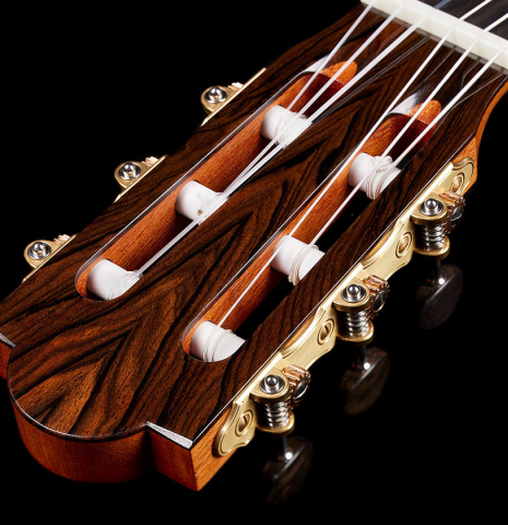 The headstock veneer and tuning machines of a 2024 Marco Bortolozzo classical guitar made of spruce and ziricote