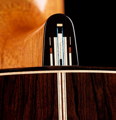 The heel cap with inlay work of a 2024 Marco Bortolozzo classical guitar made of spruce and ziricote