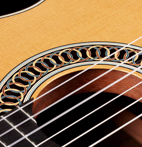 The rosette and tornavoz of a 2024 Marco Bortolozzo classical guitar made of spruce and ziricote
