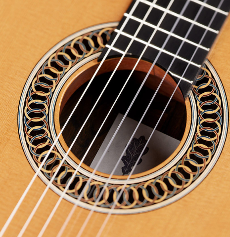 The soundboard and rosette of a 2024 Marco Bortolozzo classical guitar made of spruce and ziricote