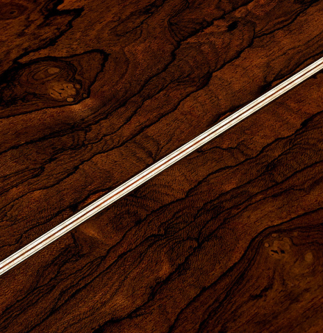 The back center seam of a 2024 Marco Bortolozzo classical guitar made of spruce and ziricote