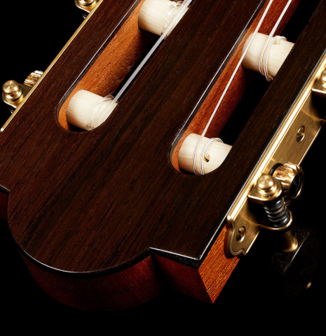 The headstock veneer and tuning machines of a 2024 Marco Bortolozzo classical guitar made of spruce and ziricote