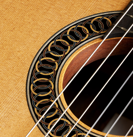 Close-up detail of the rosette and tornavoz of a 2024 Marco Bortolozzo classical guitar made of spruce and ziricote