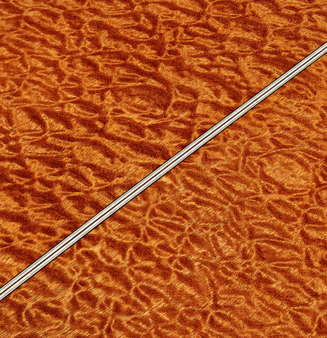 The back center strip of a 2025 Marco Bortolozzo classical guitar made of spruce and pomellè mahogany