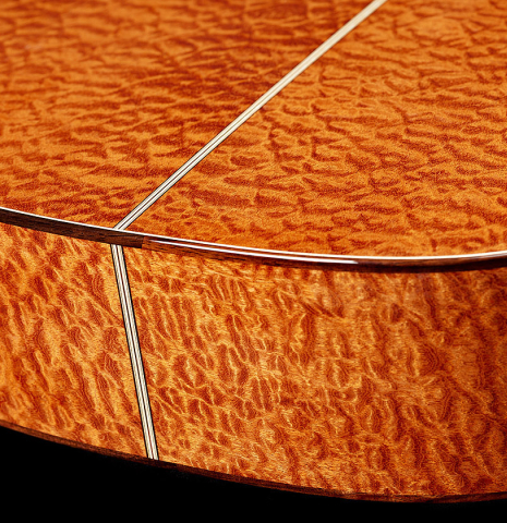 The foot of a 2025 Marco Bortolozzo classical guitar made of spruce and pomellè mahogany