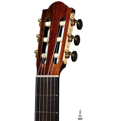The headstock of a 2025 Marco Bortolozzo classical guitar made of spruce and pomellè mahogany