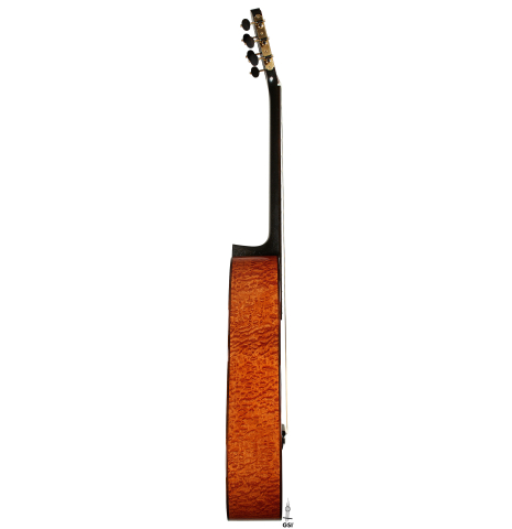 The side of a 2025 Marco Bortolozzo classical guitar made of spruce and pomellè mahogany