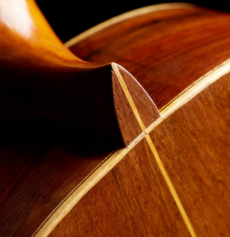 The heel, back binding and purfling of a 1947 Marcelo Barbero w/pegs classical guitar made of spruce and CSA rosewood