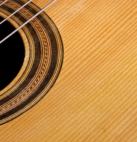 The soundboard of a 1947 Marcelo Barbero w/pegs classical guitar made of spruce and CSA rosewood