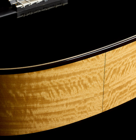 The sides at the foot of a 2026 Marco Bortolozzo "Gold Record - REG Limited Edition" classical guitar made of spruce and satinwood