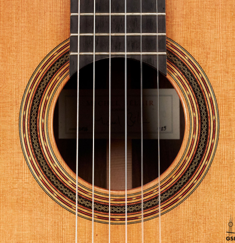 The rosette of a 2016 Michel Belair classical guitar made of cedar and Indian rosewood