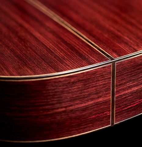 The back and sides of a 2022 Michel Belair "Hommage a Daniel Friederich" classical guitar made of cedar and Indian rosewood