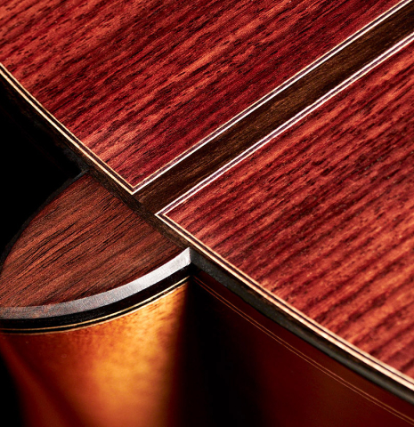 The back and heel of a 2022 Michel Belair "Hommage a Daniel Friederich" classical guitar made of cedar and Indian rosewood