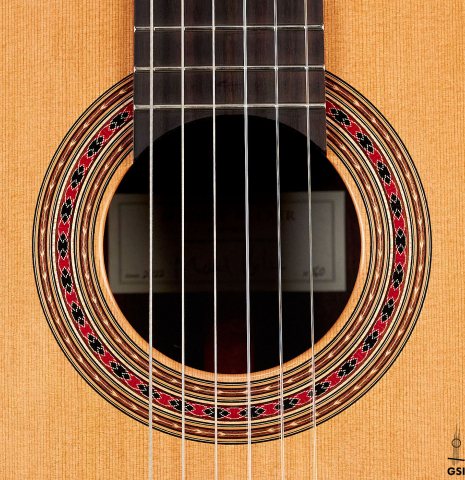 The rosette of a 2022 Michel Belair "Hommage a Daniel Friederich" classical guitar made of cedar and Indian rosewood