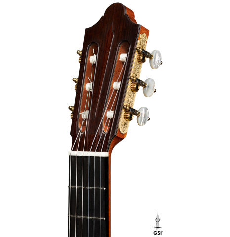 The headstock of a 2024 Michel Belair "Hommage a Daniel Friederich" classical guitar made of cedar and Indian rosewood
