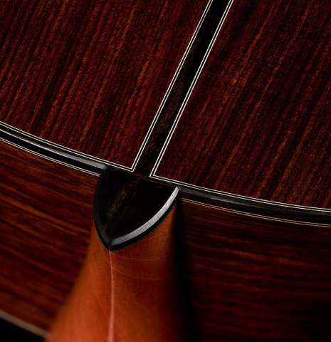 The heel and back center seam of a 2024 Michel Belair "Hommage a Daniel Friederich" classical guitar made of cedar and Indian rosewood