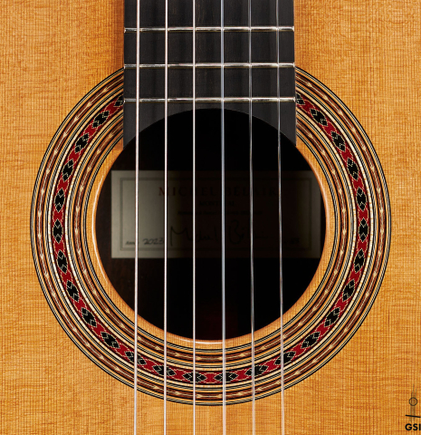 The rosette of a 2024 Michel Belair "Hommage a Daniel Friederich" classical guitar made of cedar and Indian rosewood