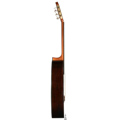 The side of a 2024 Michel Belair "Hommage a Daniel Friederich" classical guitar made of cedar and Indian rosewood
