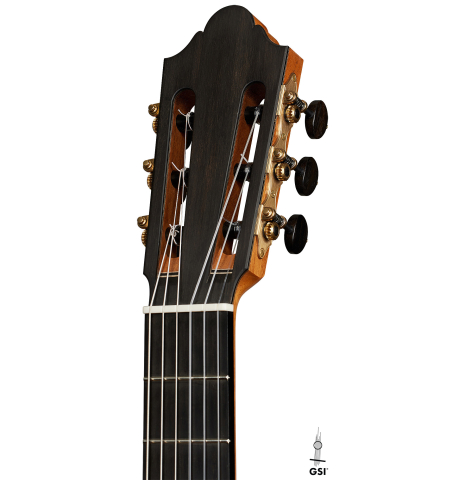 The headstock of a 2025 Michel Belair "Double Top" classical guitar made of cedar and Indian rosewood