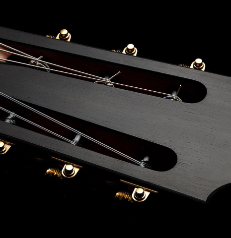 The headstock and tuning machines of a 2025 Michel Belair "Double Top" classical guitar made of cedar and Indian rosewood
