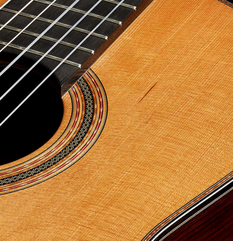 The soundboard of a 2025 Michel Belair "Double Top" classical guitar made of cedar and Indian rosewood