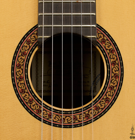 The rosette of a 1999 Jose Lopez Bellido classical guitar made of spruce and CSA rosewood