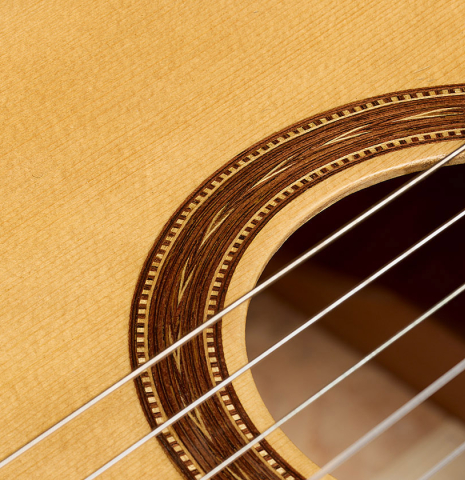 The soundboard and rosette of a 2016 Jesús Bellido "Homenaje a Torres" classical guitar made of spruce and maple