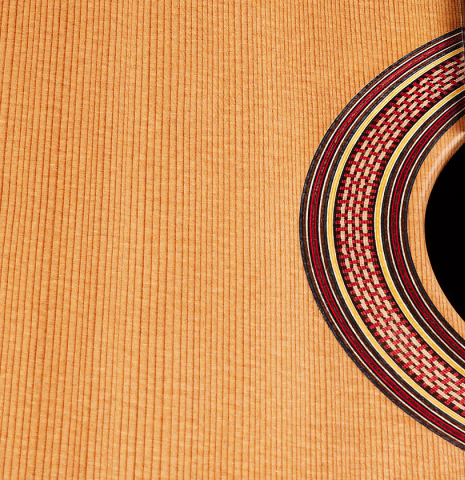 The top and rosette of a 2025 Tobias Berg classical guitar made of cedar and Indian rosewood