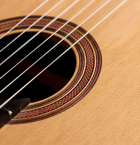 The soundboard and rosette of a 2025 Tobias Berg classical guitar made of cedar and Indian rosewood