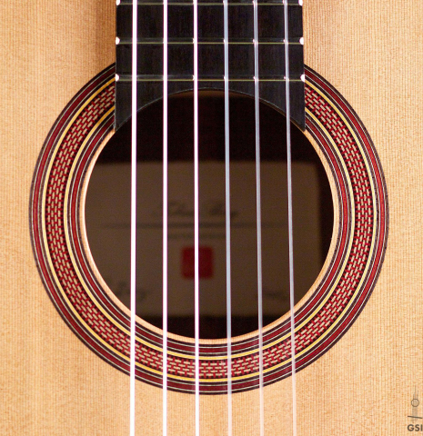 The rosette of a 2016 Tobias Berg classical guitar made of cedar and walnut