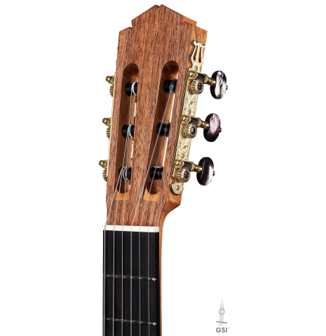 The headstock of a 2016 Tobias Berg classical guitar made of cedar and walnut