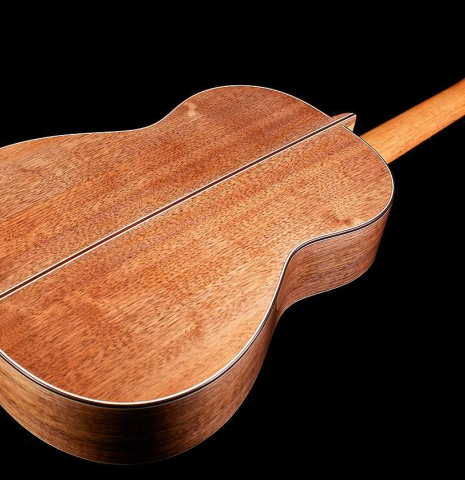 The back and sides of a 2016 Tobias Berg classical guitar made of cedar and walnut