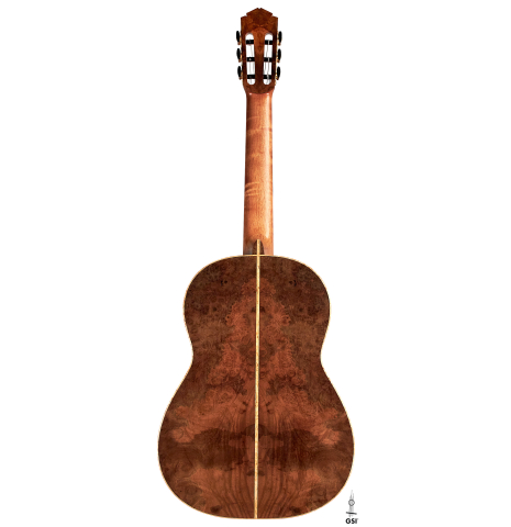 The back of a 2022 Tobias Berg classical guitar made of cedar and European walnut on a white background.