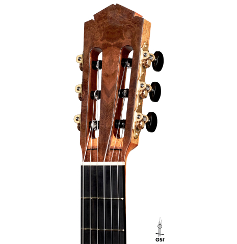 The headstock of a 2022 Tobias Berg classical guitar made of cedar and European walnut on a white background.