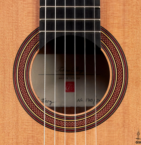 The rosette of a 2022 Tobias Berg classical guitar made of cedar and European walnut.