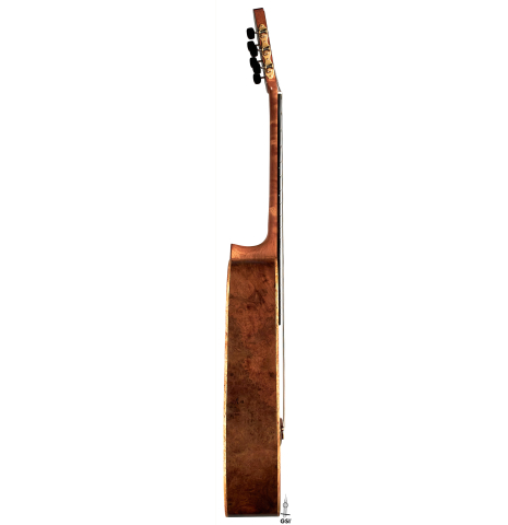 The side of a 2022 Tobias Berg classical guitar made of cedar and European walnut.