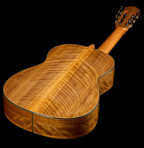 The back and sides of a 2025 Tobias Berg classical guitar made of cedar and walnut