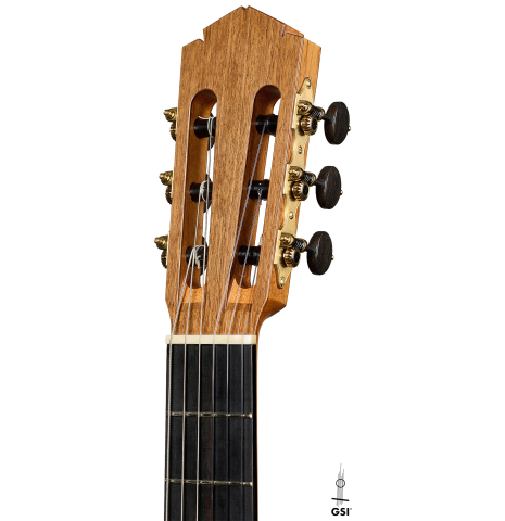 The headstock of a 2025 Tobias Berg classical guitar made of cedar and walnut