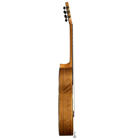 The side of a 2025 Tobias Berg classical guitar made of cedar and walnut