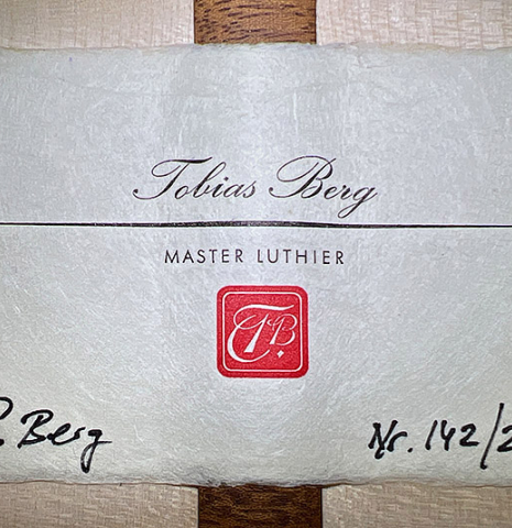 The label of a 2023 Tobias Berg classical guitar made of spruce and flamed maple.