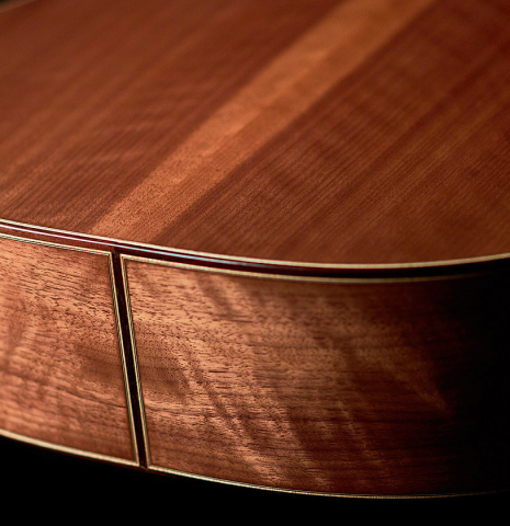 A binding between the back and sides of a 2022 Tobias Berg classical guitar