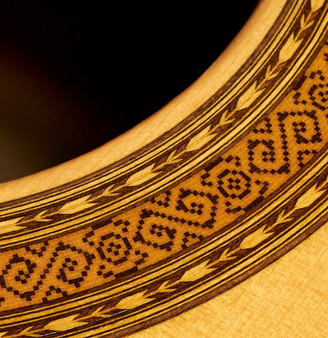 A close-up of the rosette of a 2000 Paulino Bernabe &quot;Millenium&quot; classical guitar made of spruce and CSA rosewood