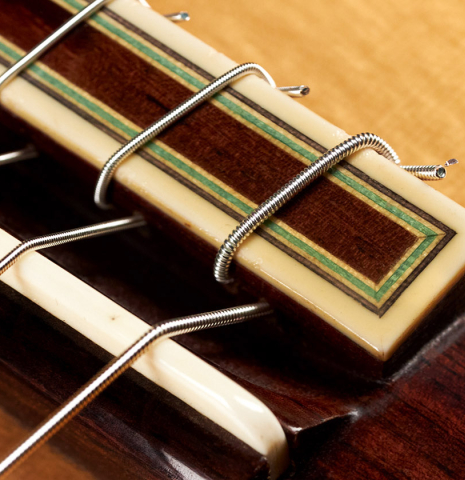 The tie block of a 2007 Paulino Bernabe "Leonardo" classical guitar made with spruce and African rosewood.