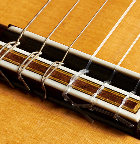 The bridge, tie-block and saddle of a 2000 Paulino Bernabe "50" classical guitar made of spruce and CSA rosewood