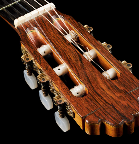 The headstock and tuning machines of a 2000 Paulino Bernabe "50" classical guitar made of spruce and CSA rosewood