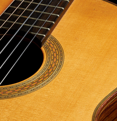 The top and rosette of a 2000 Paulino Bernabe "50" classical guitar made of spruce and CSA rosewood